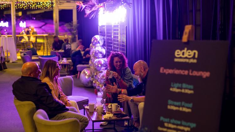 People enjoying drinks and snacks in Eden Sessions Plus lounge after a show